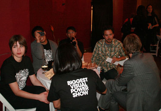 speakers and crew chitchatting backstage