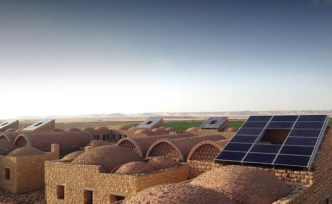 This village is powered by building-integrated solar panels and provides shelter for 350 people, putting sunlight to better use.